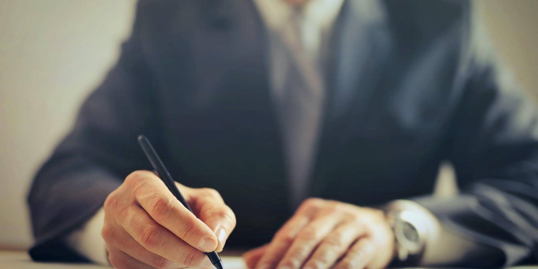 pexels-photo-3771097 crop businessman signing contract in office